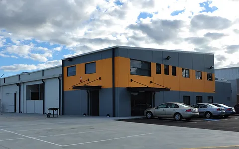 Modern warehouse facade that could match a coded facility address


