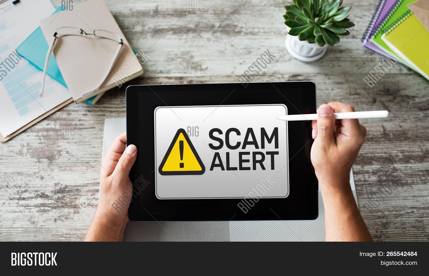 Smartphone showing scam alert for unknown number