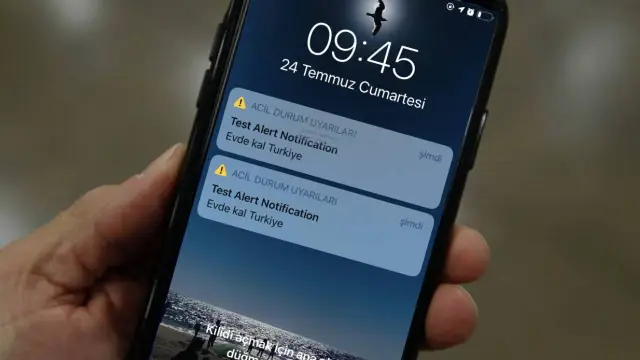 Alert on phone screen warning user about 1218240924 as spam