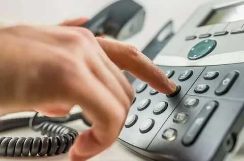 Person declining suspicious call from +44 20 3322 2305
