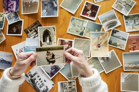 A child looking at an old family photo album