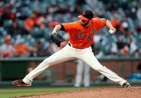 San Francisco Giants pitcher prepares to throw during high-pressure moment