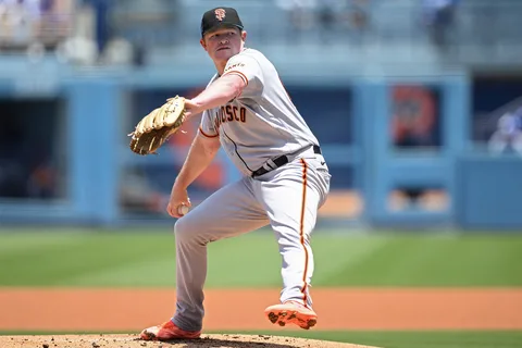 Giants pitcher Logan Webb delivering a pitch to Dodgers