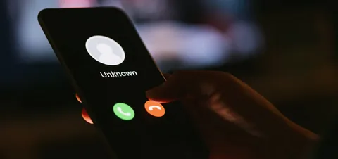 Suspicious number 1258588702 displayed on phone screen