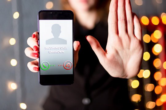Incoming call from 7418374068 on a smartphone