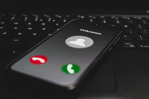 Incoming call showing 03316306277 on mobile screen
