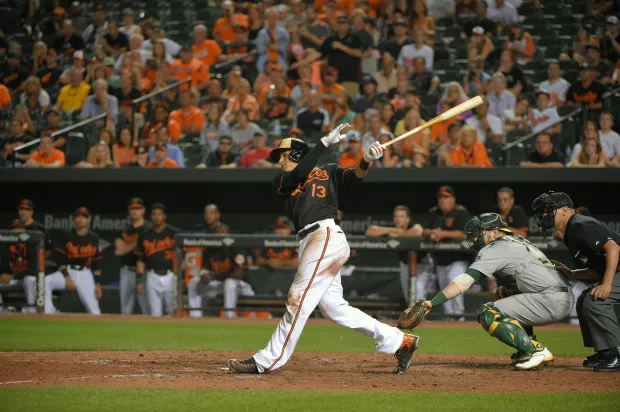 Baltimore Orioles batter swings at a pitch against San Francisco Giants