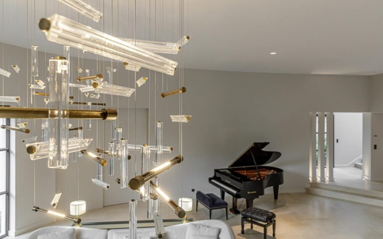 Handcrafted bespoke lighting from The Lamp Workshop illuminating a cozy living space