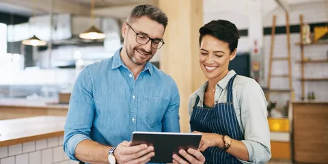 Business team reading thesmallbusinesstimes for planning and decision making